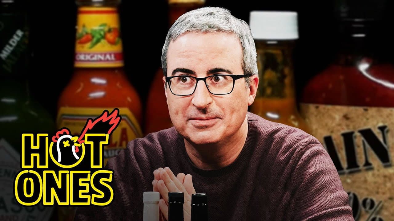 Still from John Oliver Fears for Humanity While Eating Spicy Wings