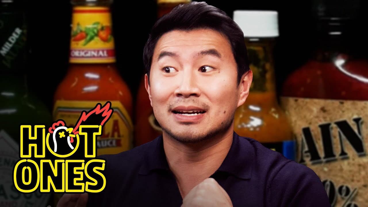 Still from Simu Liu Chugs Boba While Eating Spicy Wings