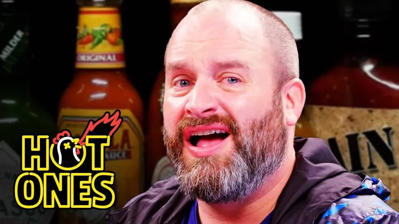 Still from Tom Segura Tears Up While Eating Spicy Wings