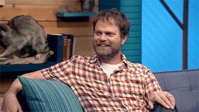 Still from Rainn Wilson Wears a Short Sleeved Plaid Shirt & Colorful Sneakers