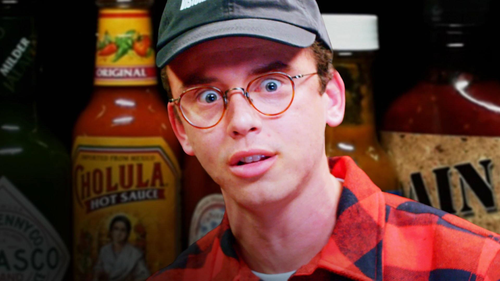 Still from Logic Solves a Rubik's Cube While Eating Spicy Wings