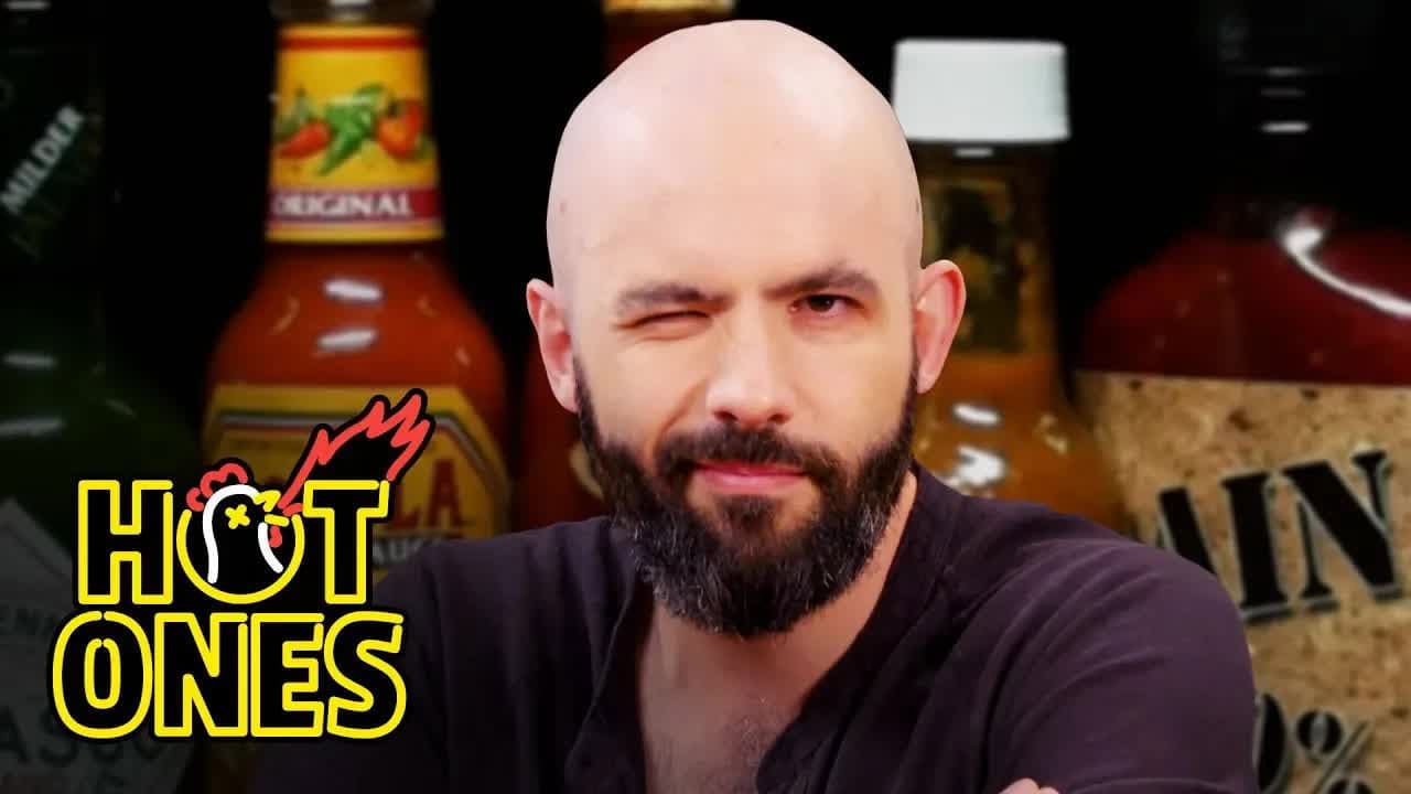 Still from Binging with Babish Gets a Tattoo While Eating Spicy Wings