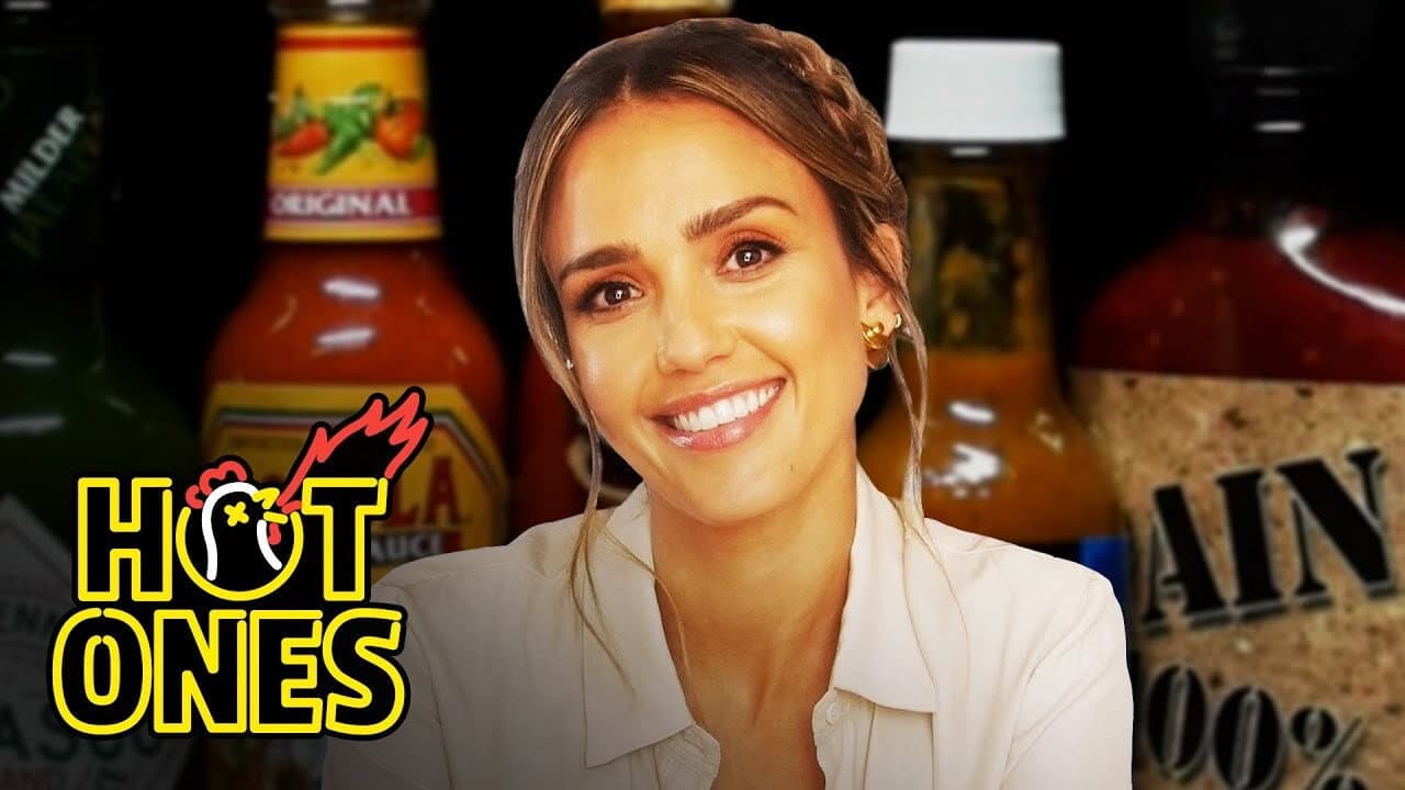 Still from Jessica Alba Applies Lip Gloss While Eating Spicy Wings