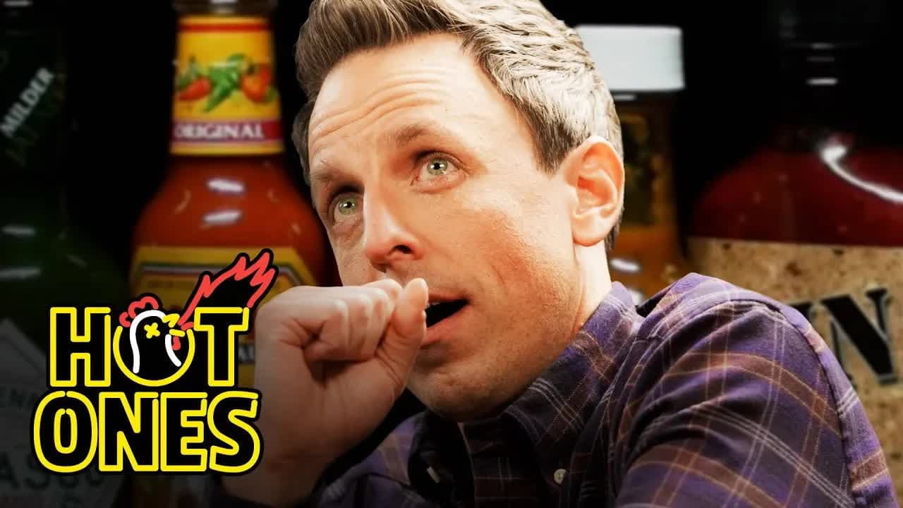 Still from Seth Meyers Unravels While Eating Spicy Wings