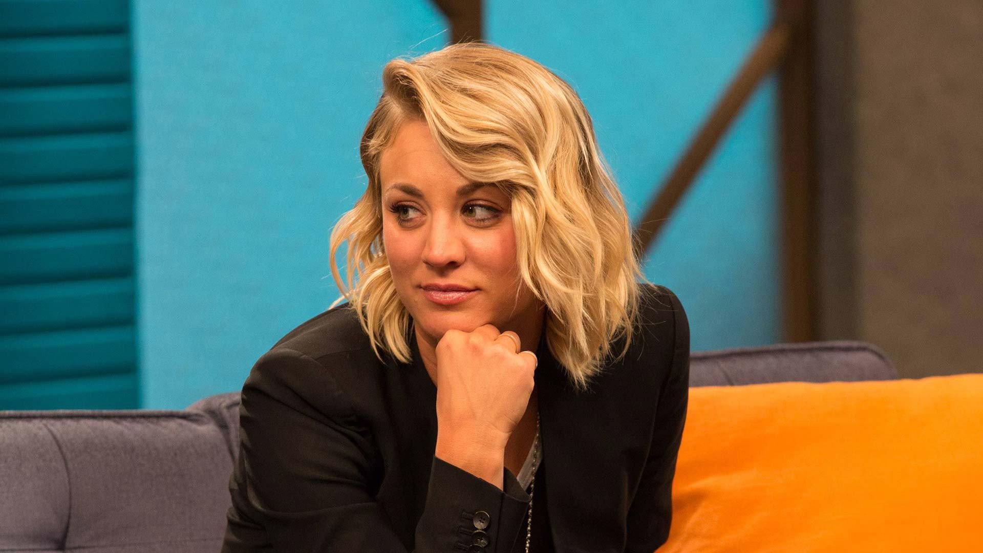 Still from Kaley Cuoco Wears a Black Blazer and Slip-on Sneakers