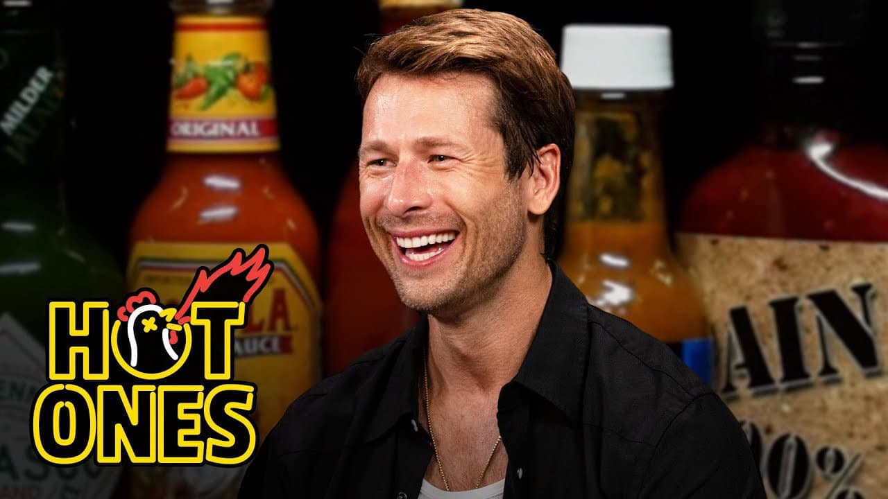 Still from Glen Powell Needs a Wingman While Eating Spicy Wings