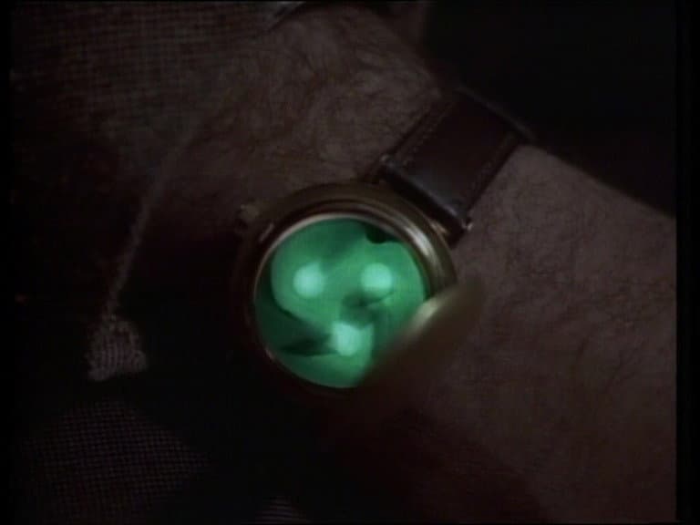Still from Profile in Silver / Button, Button