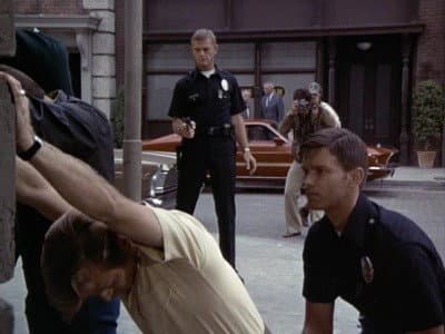 Still from Log 052: Good Cop: Handle with Care
