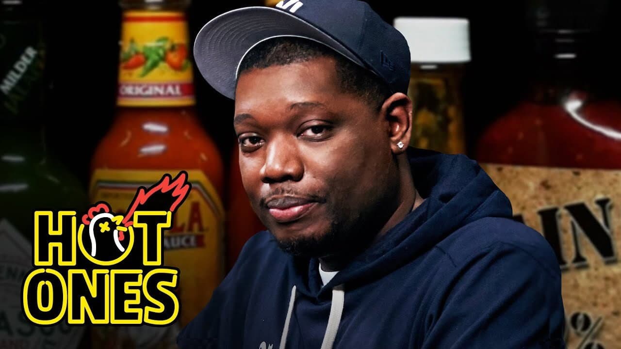 Still from Michael Che Gs Up While Eating Spicy Wings