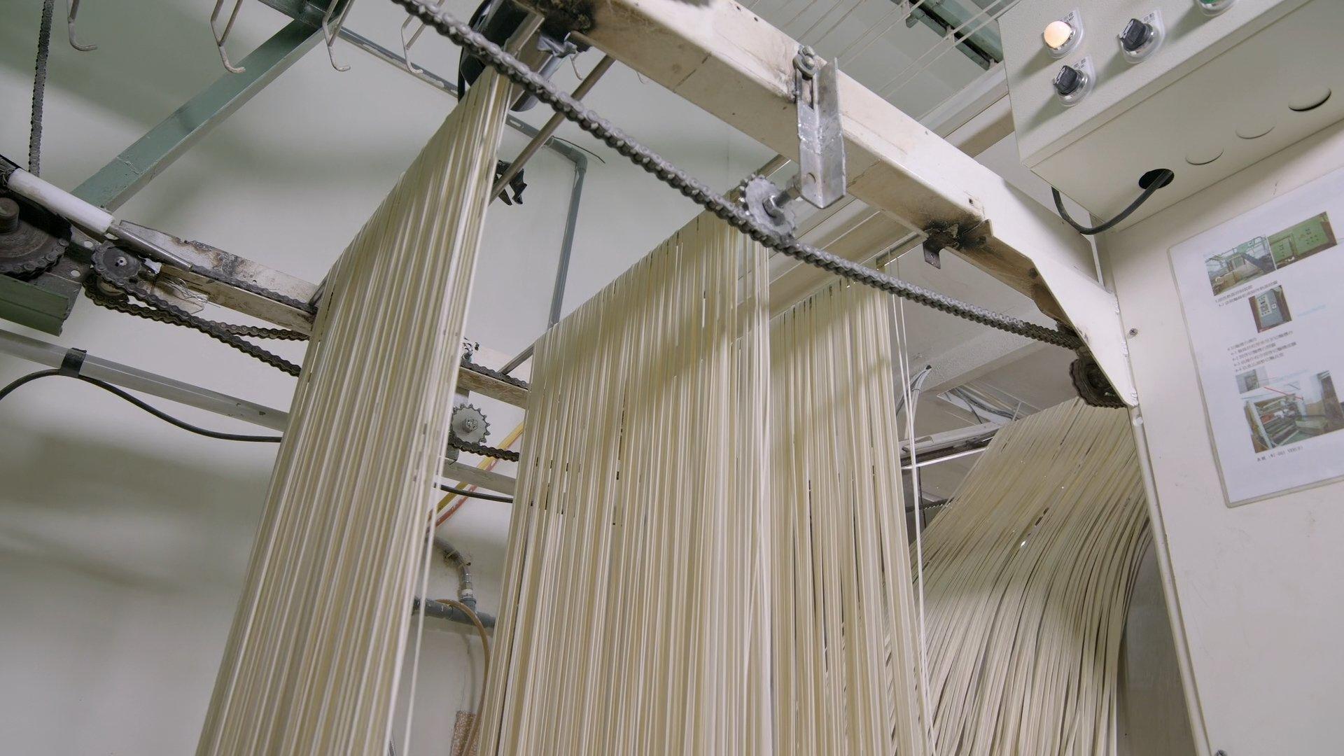 Still from Cotton, Rodeo Roping Chutes, Asian Noodles, Rotary Engines