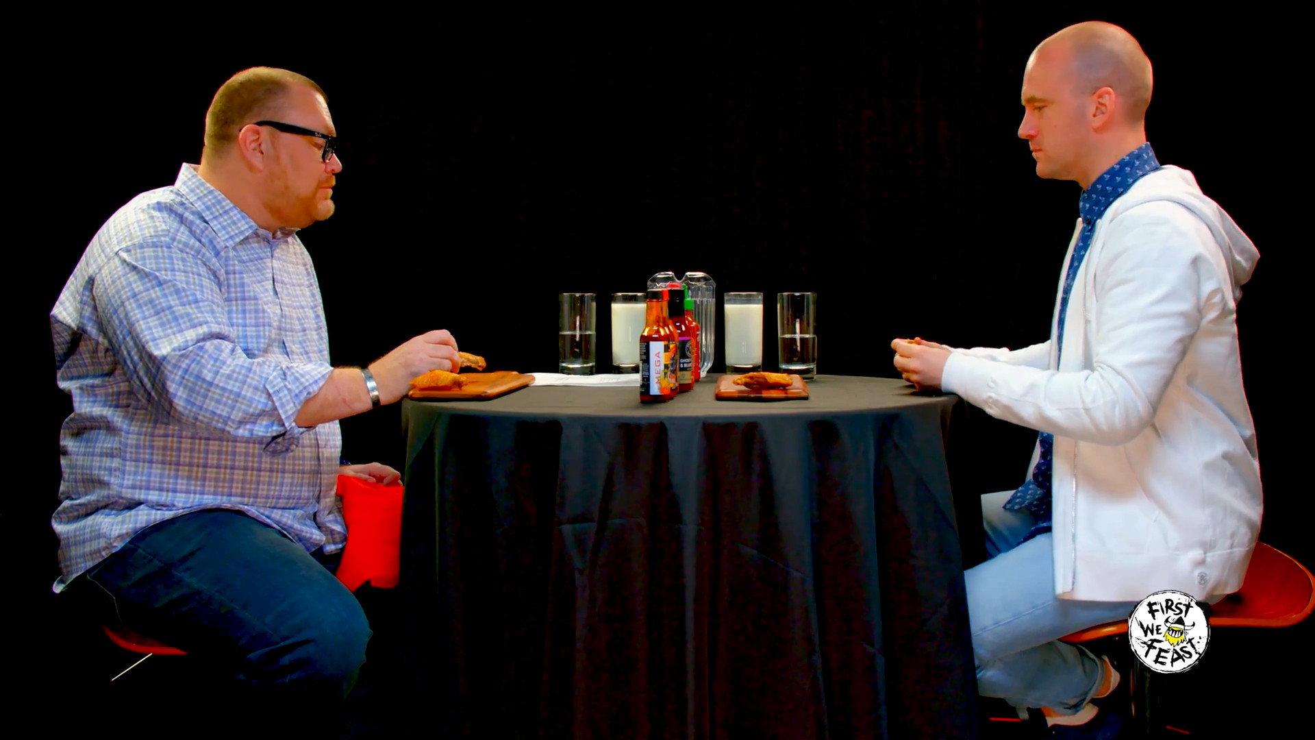 Still from Superfan Brett Baker Grills Sean Evans Over Spicy Wings