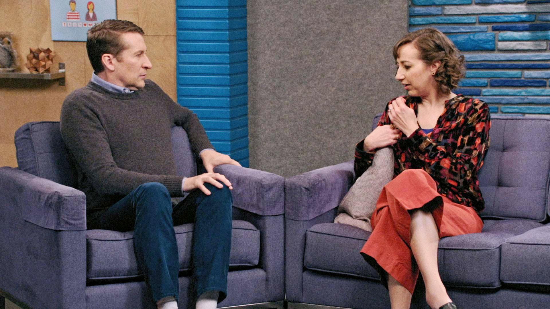 Still from Kristen Schaal Wears Strawberry Colored Pants and a Multicolored Shirt